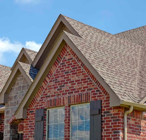 Brick house with newly installed shingles