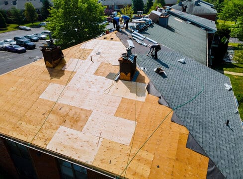 Roofing contractors performing roof installation in Miramar, FL.
